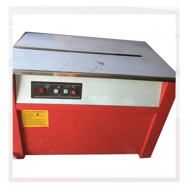 Box Strapping Machine manufactured by AVM Packaging System